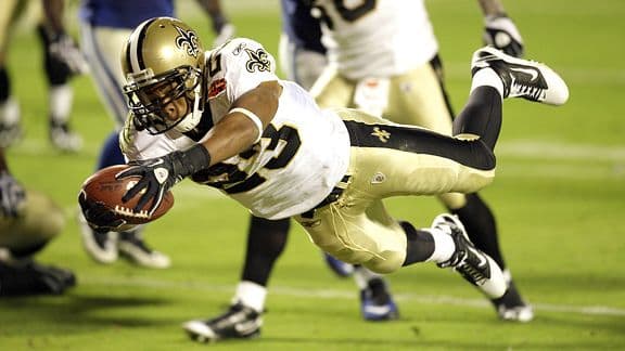 Feb 7, 2010 ; Miami Gardens, FL, USA; New Orleans Saints running back Pierre Thomas (23) dives across the goal line for a touchdown in the third quarter of Super Bowl XLIV at Sun-Life Stadium. The Saints defeated the Indianapolis Colts 31-17. Mandatory Credit: Matthew Emmons – US PRESSWIRE